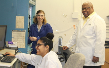 Warner and students in lab.